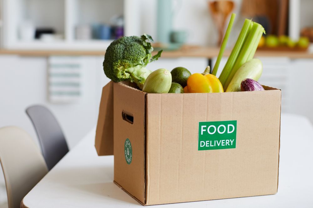 Close up Of Fresh Vegetables In Cardboard Box On The Table Delivered To Home — Fresh to Door In Canberra ACT