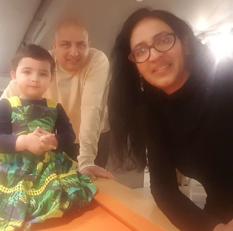 Jasmine and Marcus, founders of HomeSchool PlayLab, seated at a worktable