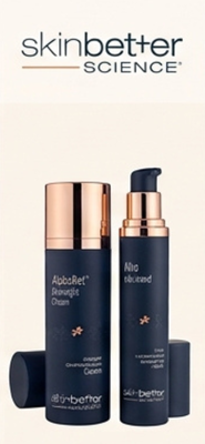 Skinbetter Science skincare products in navy and copper bottles on a light background