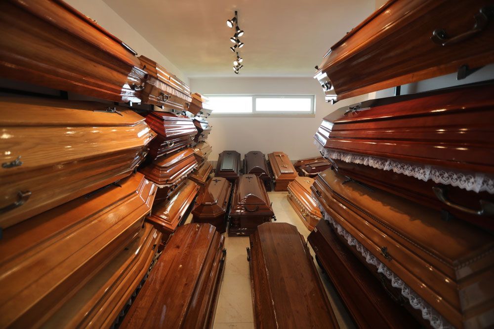 Wooden Coffins In The Room — Funeral Extras & Urns in The Entrance, NSW