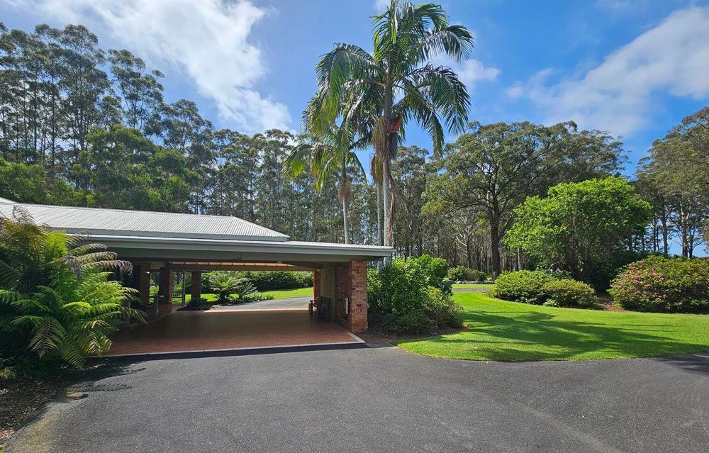 A Driveway With A Covered Garage — Timeless Funerals in Macquarie Park, NSW
