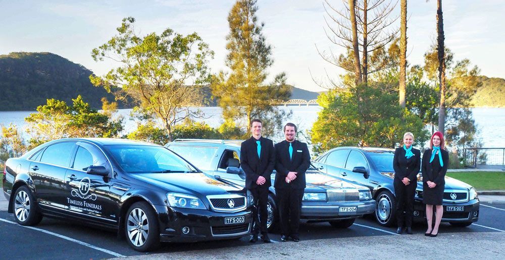 Our Teams Standing Next To The Hearses — Trusted Funeral Directors in The Entrance, NSW