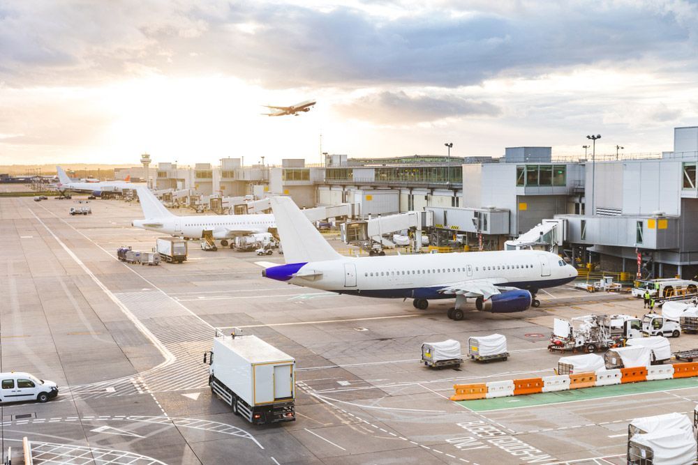 Busy Airport View With Airplanes For Repatriation — Interstate & International Repatriation in The Entrance, NSW