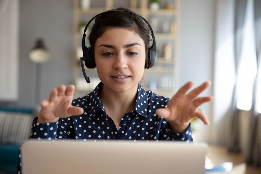 Woman Wear Wireless Headset And Calling On Laptop — Create an Online Will in The Entrance, NSW
