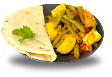 Een bord met eten met een tortilla en sperziebonen erop