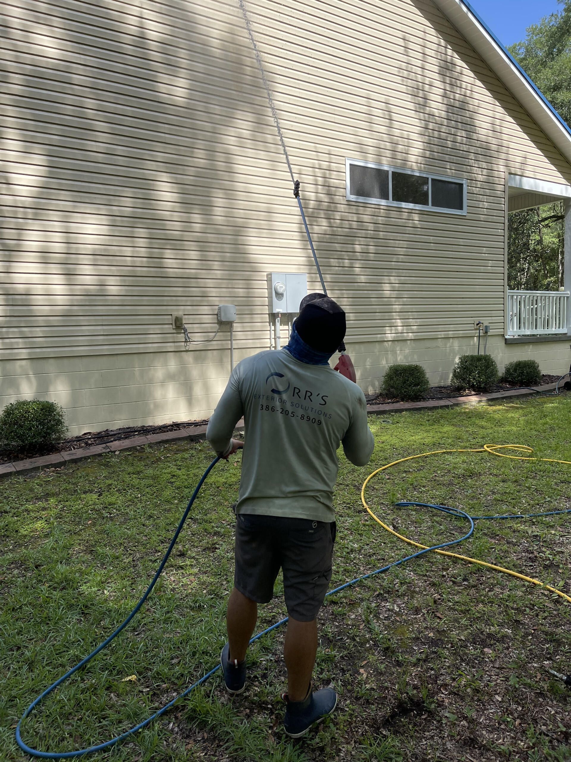 Brick House Wall Pressure Washing with Special Cleaning Detergent.