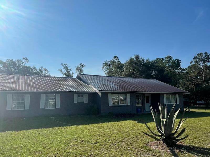 Cleaning Red Metal Roof Before