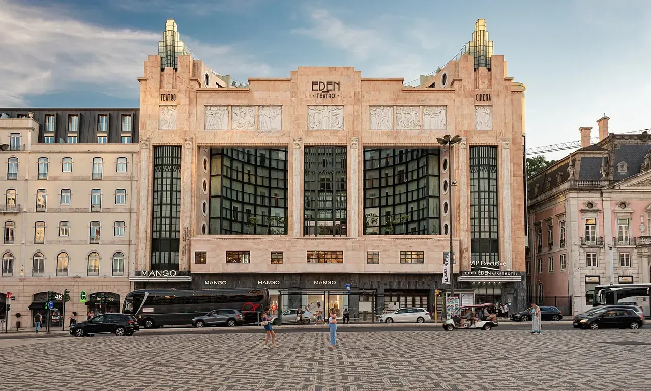 The cream Art Deco façade of the Éden building, with EDEN lettering at the top, on Praça dos Restauradores in Lisbon