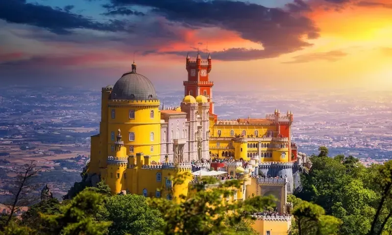 Pena Palace above the Serra de Sintra at sunset