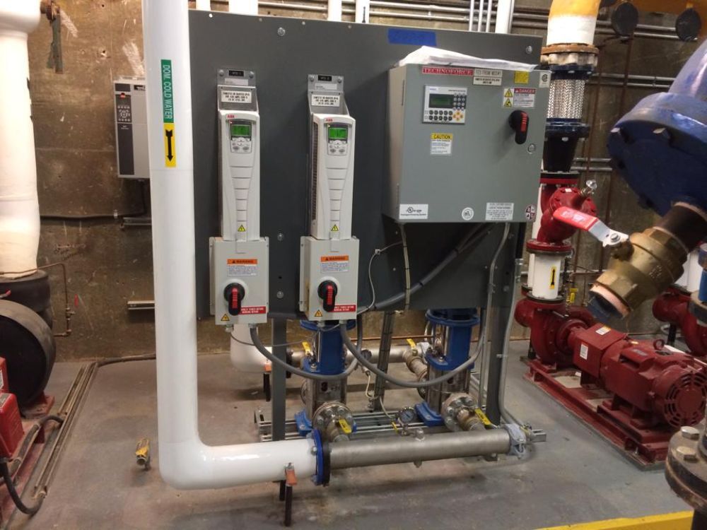 A room filled with lots of pipes and electrical equipment.