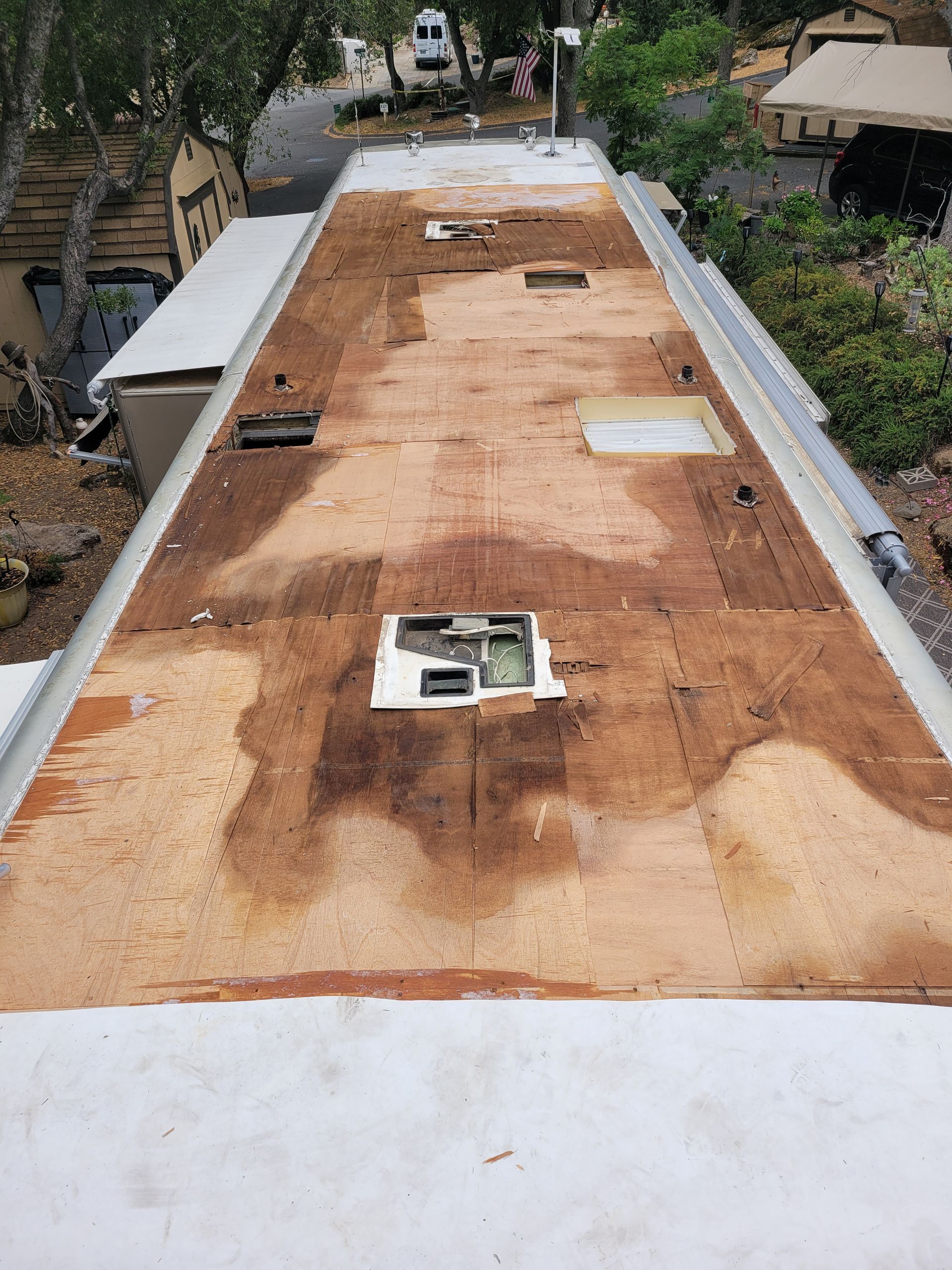 The roof of a rv is being repaired.
