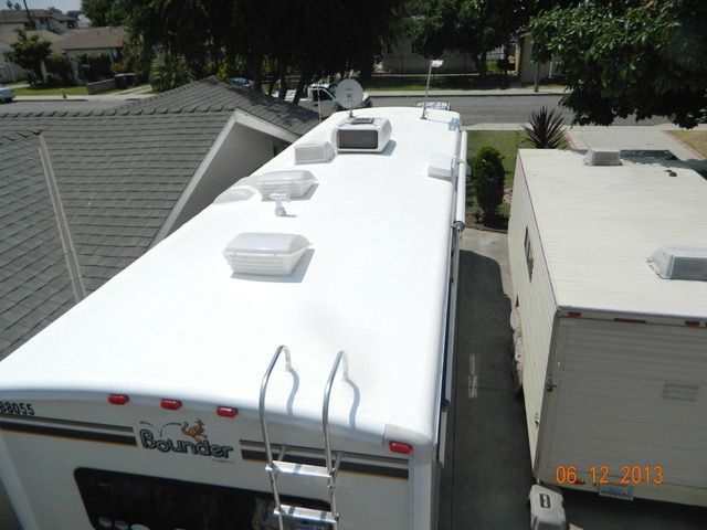 A white rv with the word boundary on the back