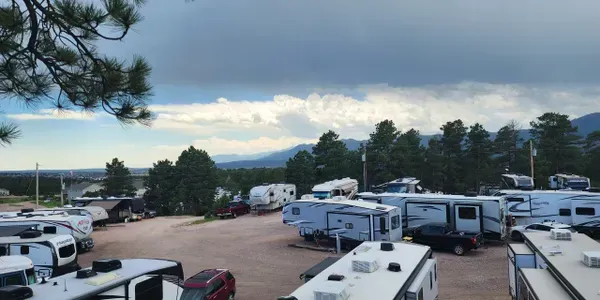 A lot of rvs are parked in an rv park with mountains in the background. Lake Havasu AZ