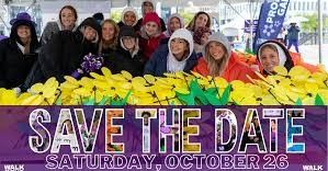 Group of people in coats, smiling, surrounded by yellow flowers, save the date text for October 26.