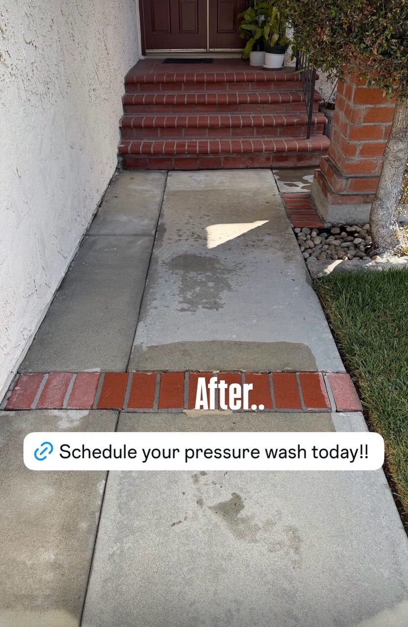 Concrete walkway leading to red steps and a doorway, with an overlaid ad reading “Schedule your pressure wash today!”