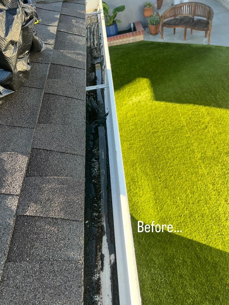 Rooftop edge beside bright green lawn, with a “Before” label on the grass.