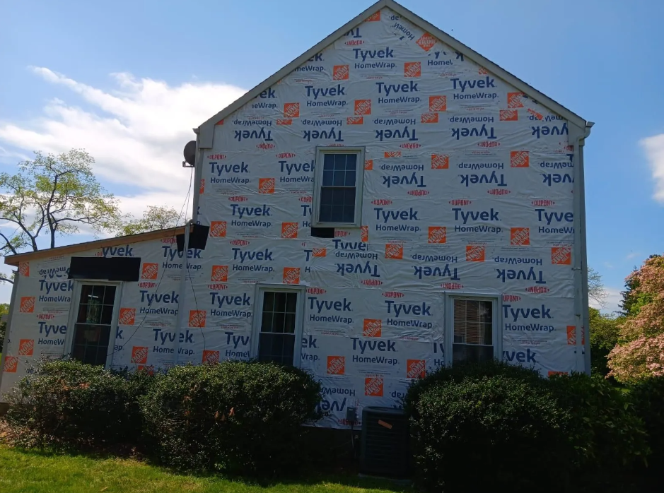 A house is covered in tyvek insulation.