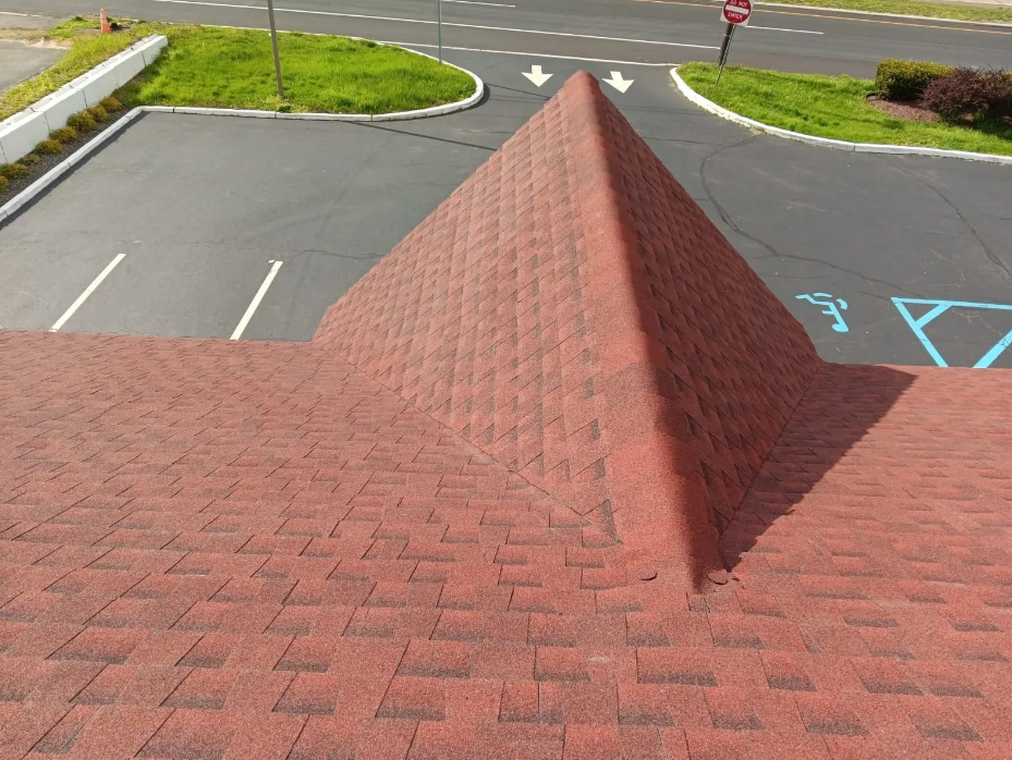 The roof of a building has a pyramid shaped roof
