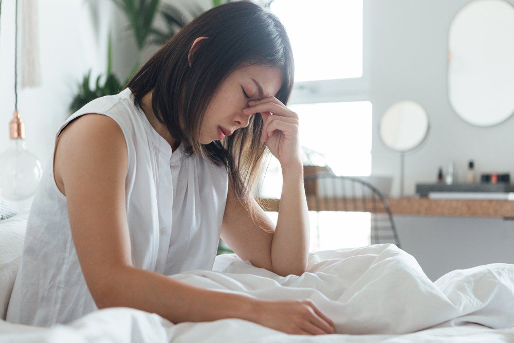 Woman With Headache — Tavernier, FL — Garrett Chiropractic & Wellness Center