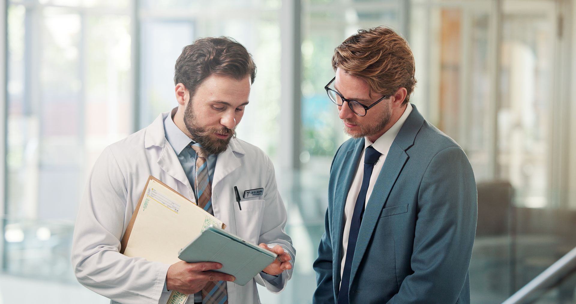 A man is talking with a healthcare advocate. A man is talking with a healthcare advocate.