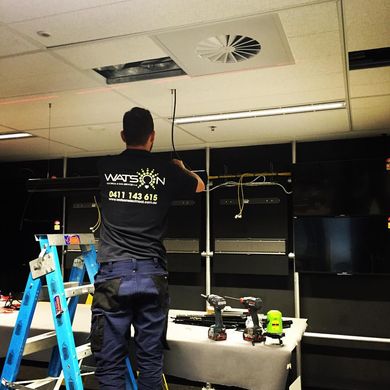 Electrician Working On Commercial Store — Electricians in Sydney, NSW Electrician Working On Commercial Store — Electricians in Sydney, NSW