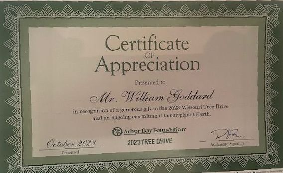 A certificate of appreciation is presented to mr. william goldbard