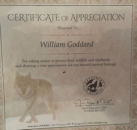 A certificate of appreciation is presented to william goddard