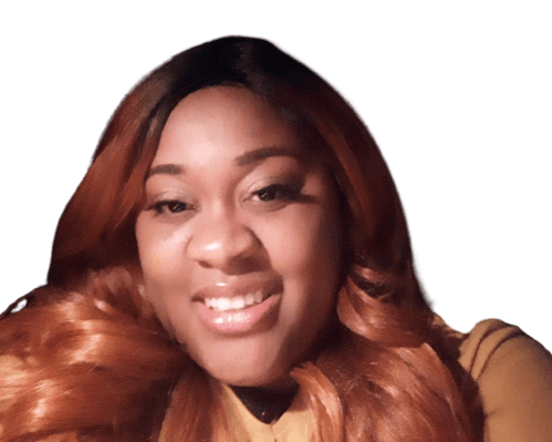 Woman with auburn hair smiles, looking towards the viewer, white background.
