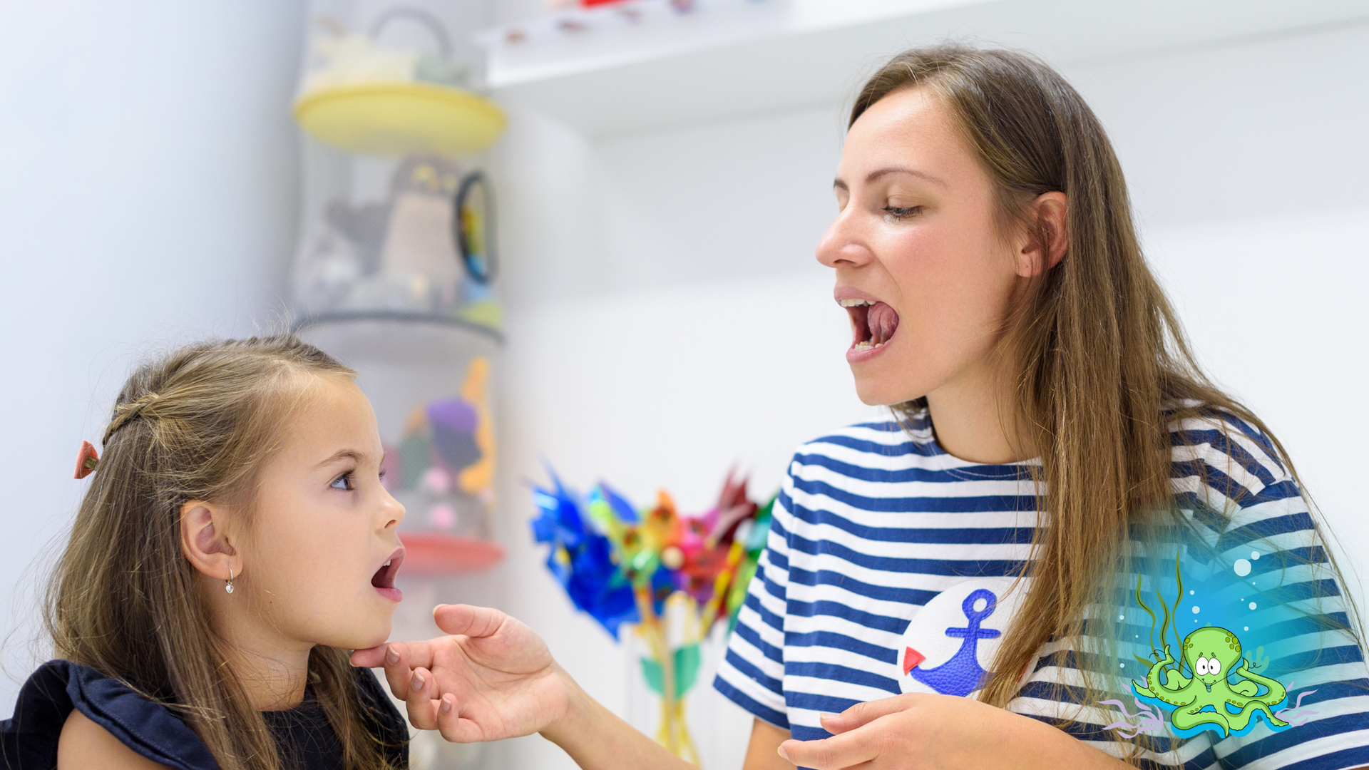 Speech therapist assisting a young girl with articulation exercises; white room, striped shirt.