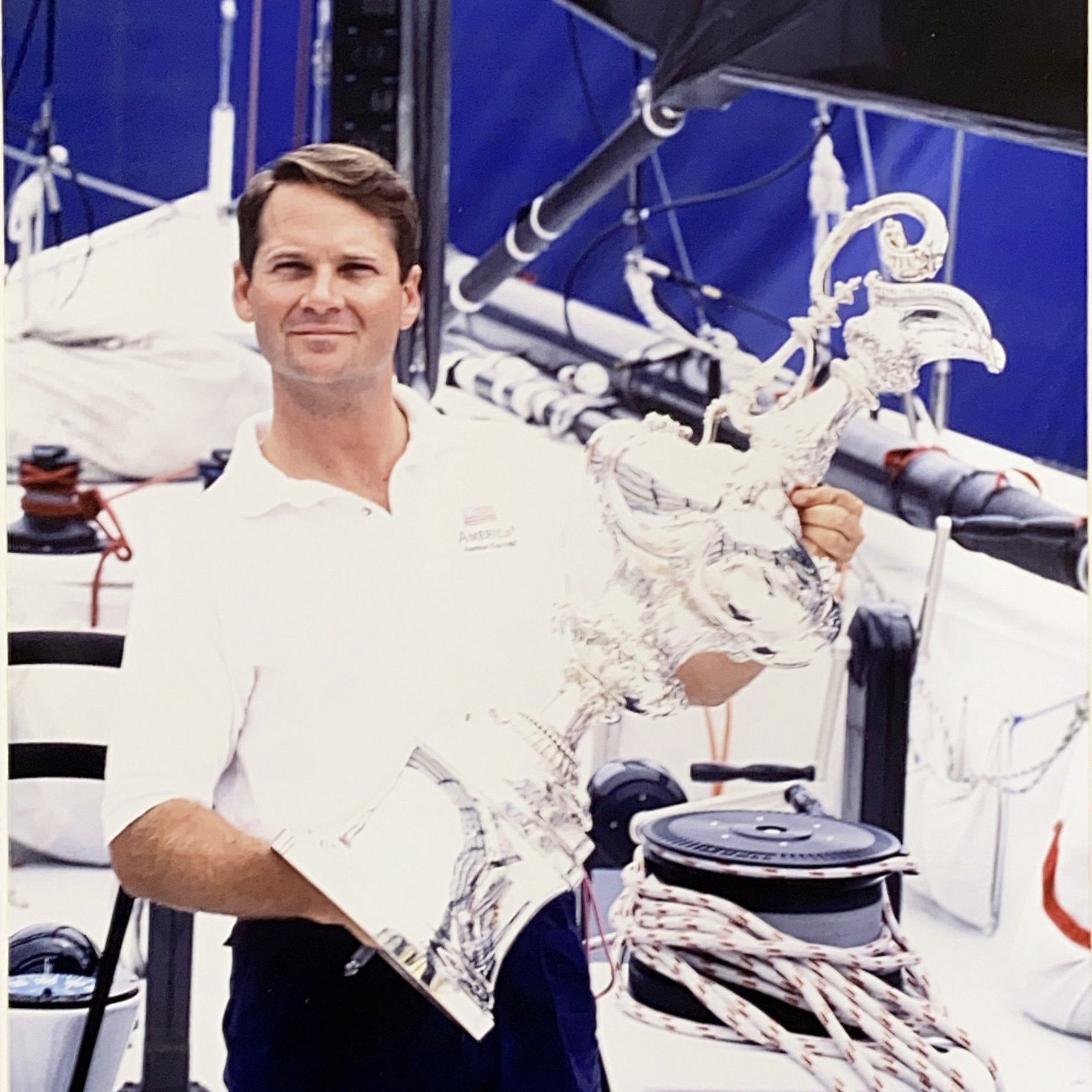 Dr. Mark Herschberger holding a cup award