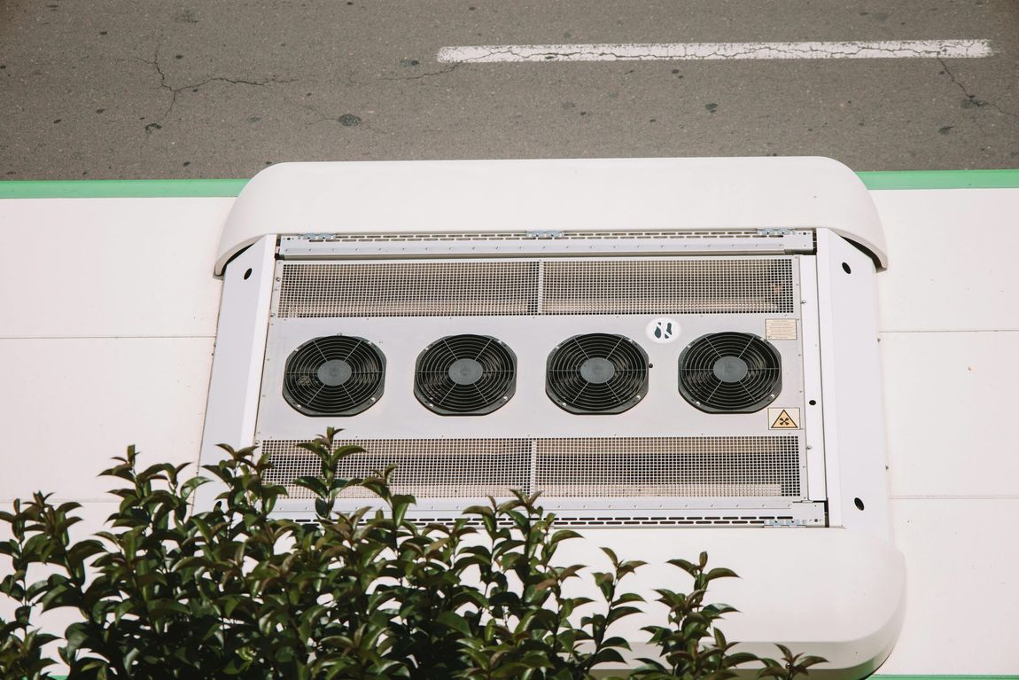 A white box with four fans on top of it