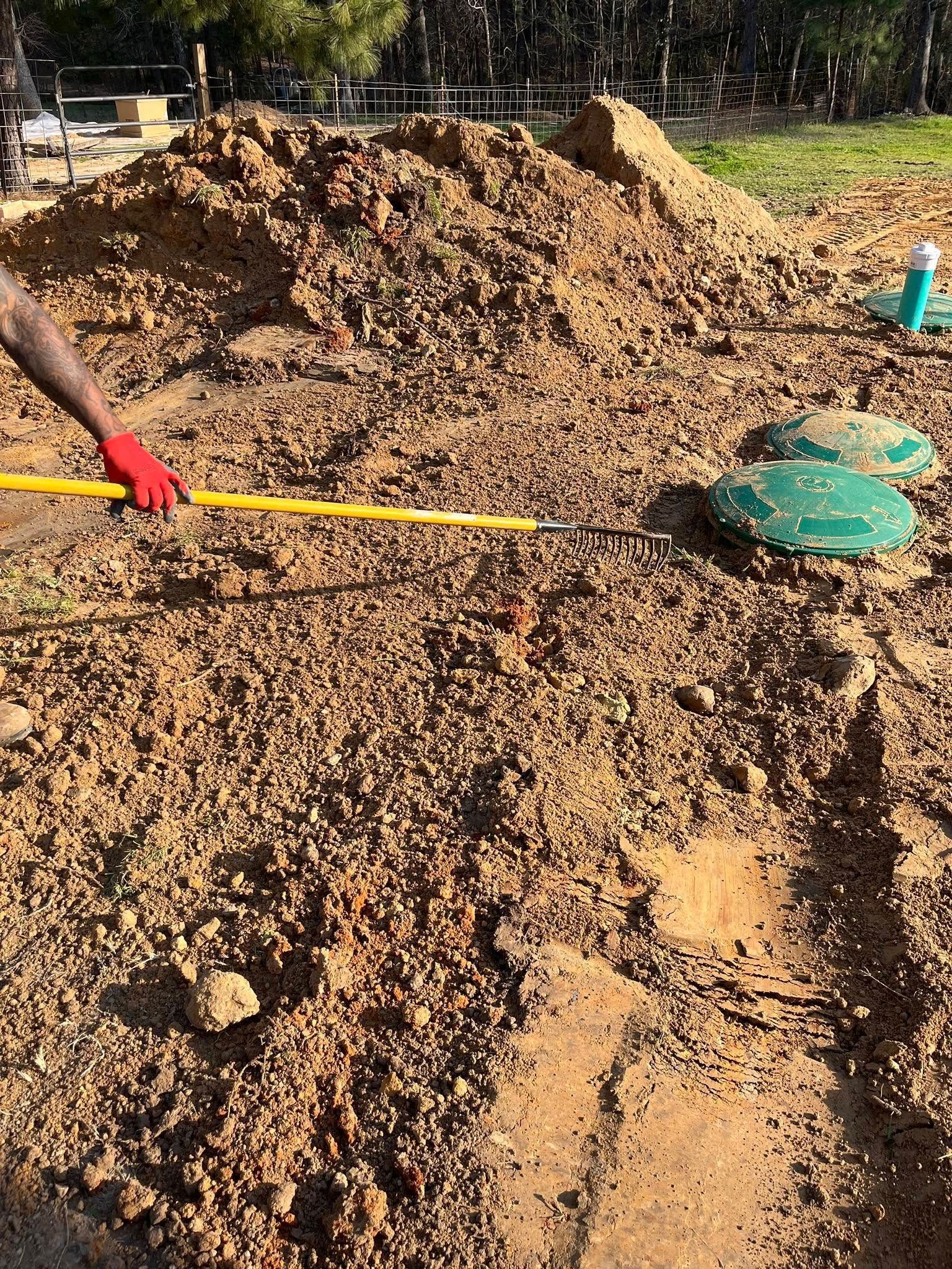 A person is digging in the dirt with a shovel.