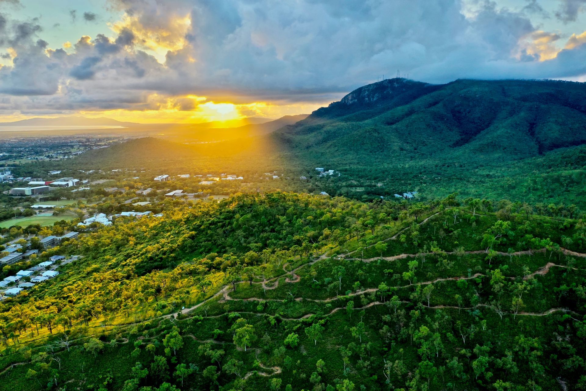 Sunset Over Green Mountains, Casting Light on A Town Below — Harwood Plumbing & Gasfitting Pty Ltd in Stuart Park, NT