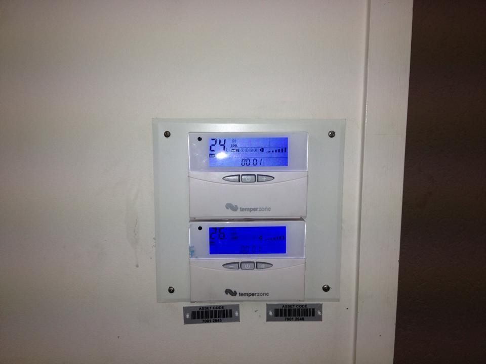A Thermostat on a Wall Shows the Temperature is 24 Degrees — Legit Air Conditioning & Refrigeration in Garbutt, QLD