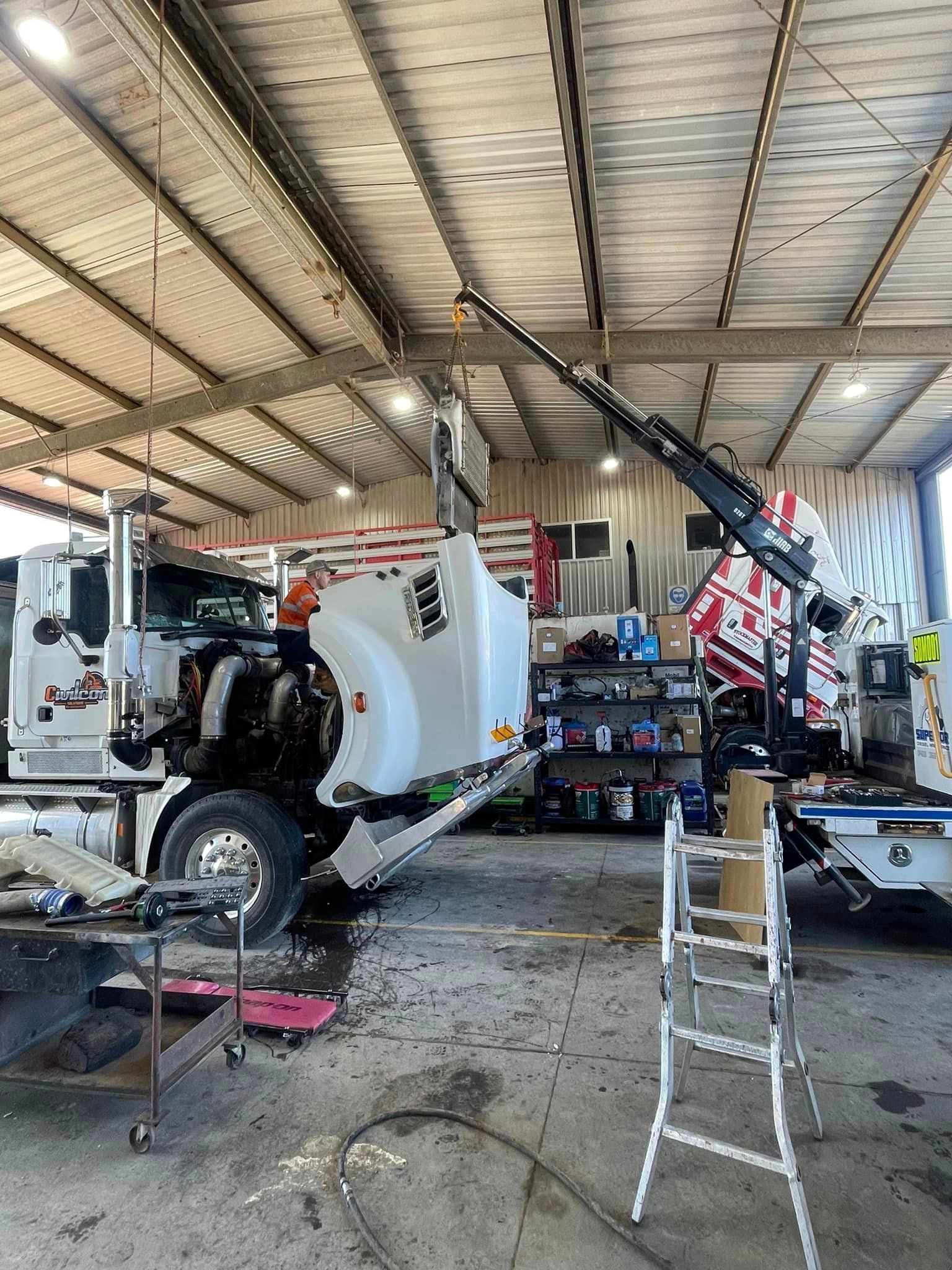 Worker Performing Heavy Vehicle Maintenance — Superior Diesel Maintenance in Westdale, NSW