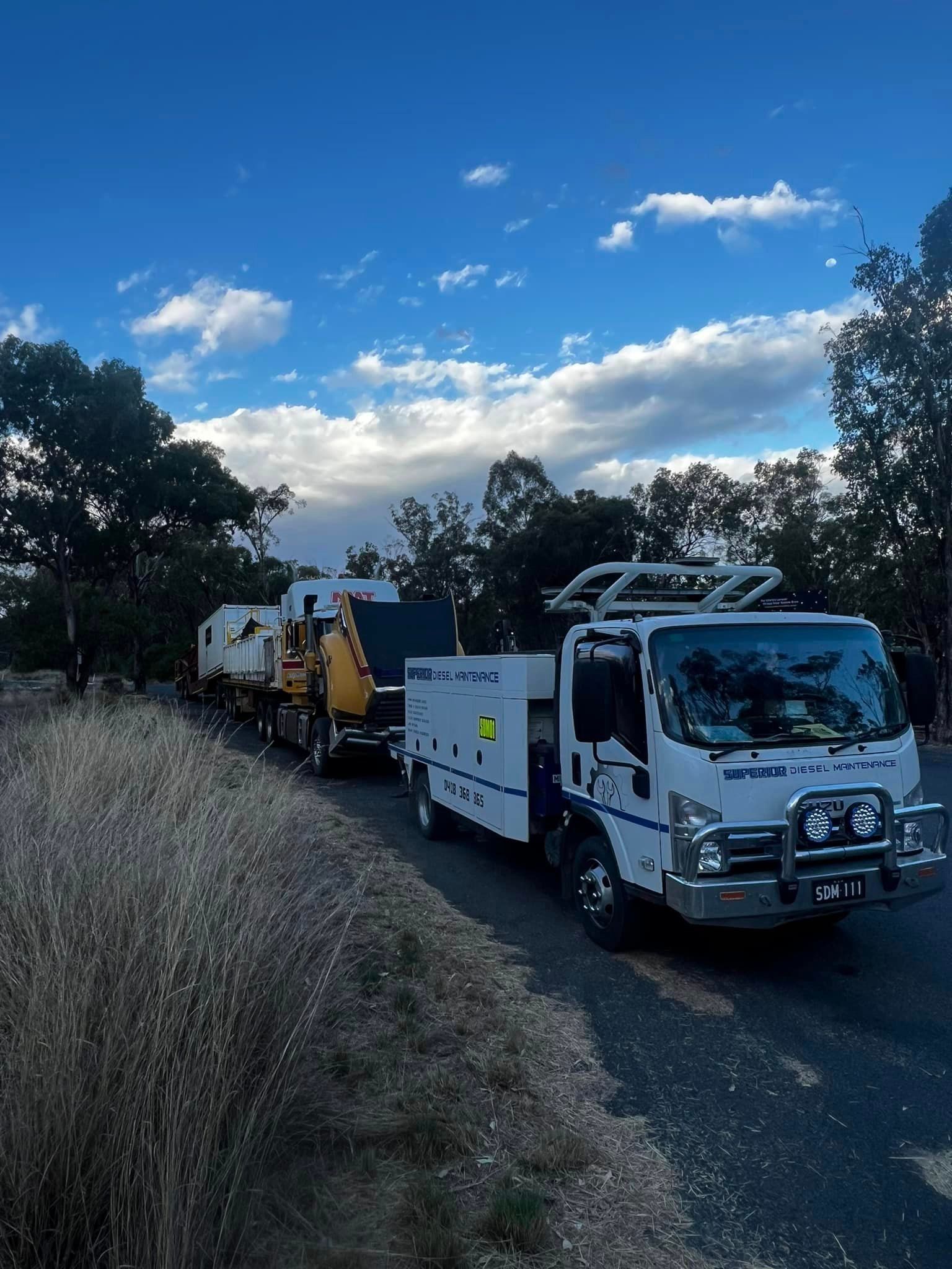 Mechanic Repairing Truck Wheel — Superior Diesel Maintenance in Westdale, NSW