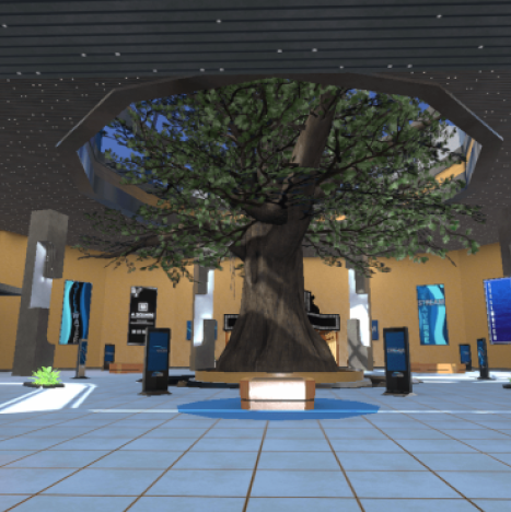 Indoor plaza with a large tree sculpture under a skylight, surrounded by blue and tan walls.
