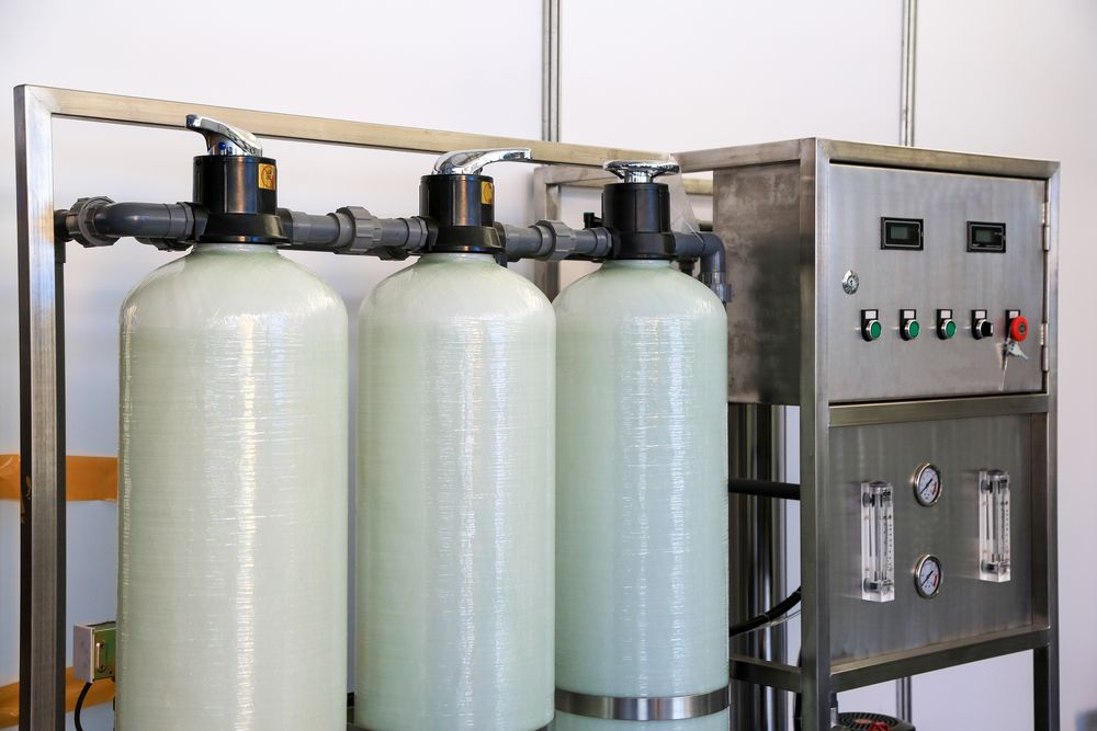 A Water Treatment System With Three Tanks And A Control Panel — Nudges Plumbing In Nyngan, NSW