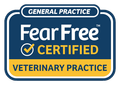 Fear Free Certified veterinary practice sign in blue, white, and yellow with checkmark logo