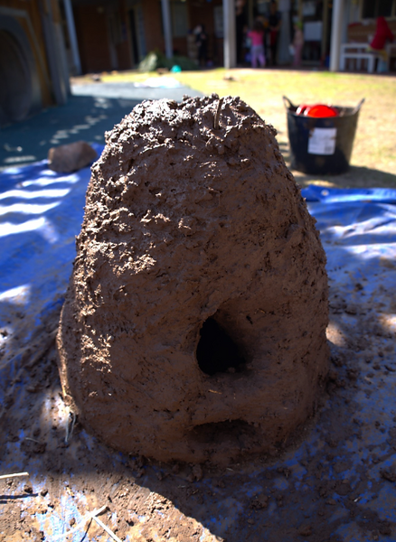 A large mound of dirt with a hole in the middle