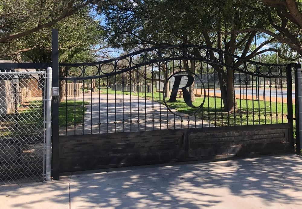 Black wrought iron gate with an 