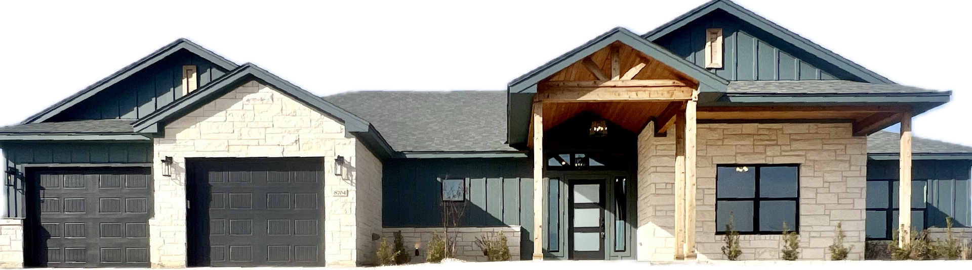A modern, single-story house with stone and dark siding. It has a covered entry and two garage doors.