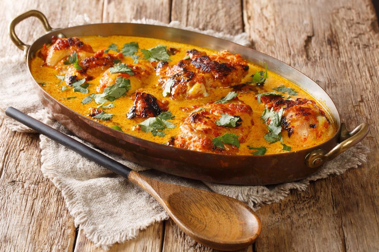 Chicken curry in a copper pan