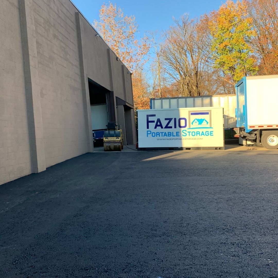 Exterior of Fazio Portable Storage facility with containers and a truck.