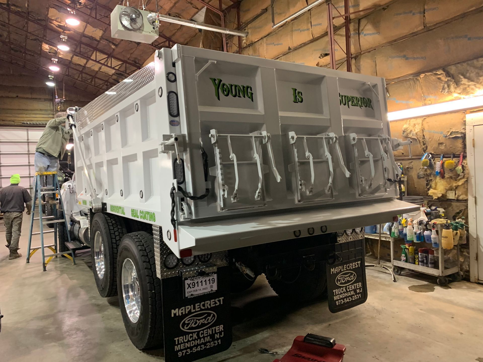 White dump truck with a raised bed, 