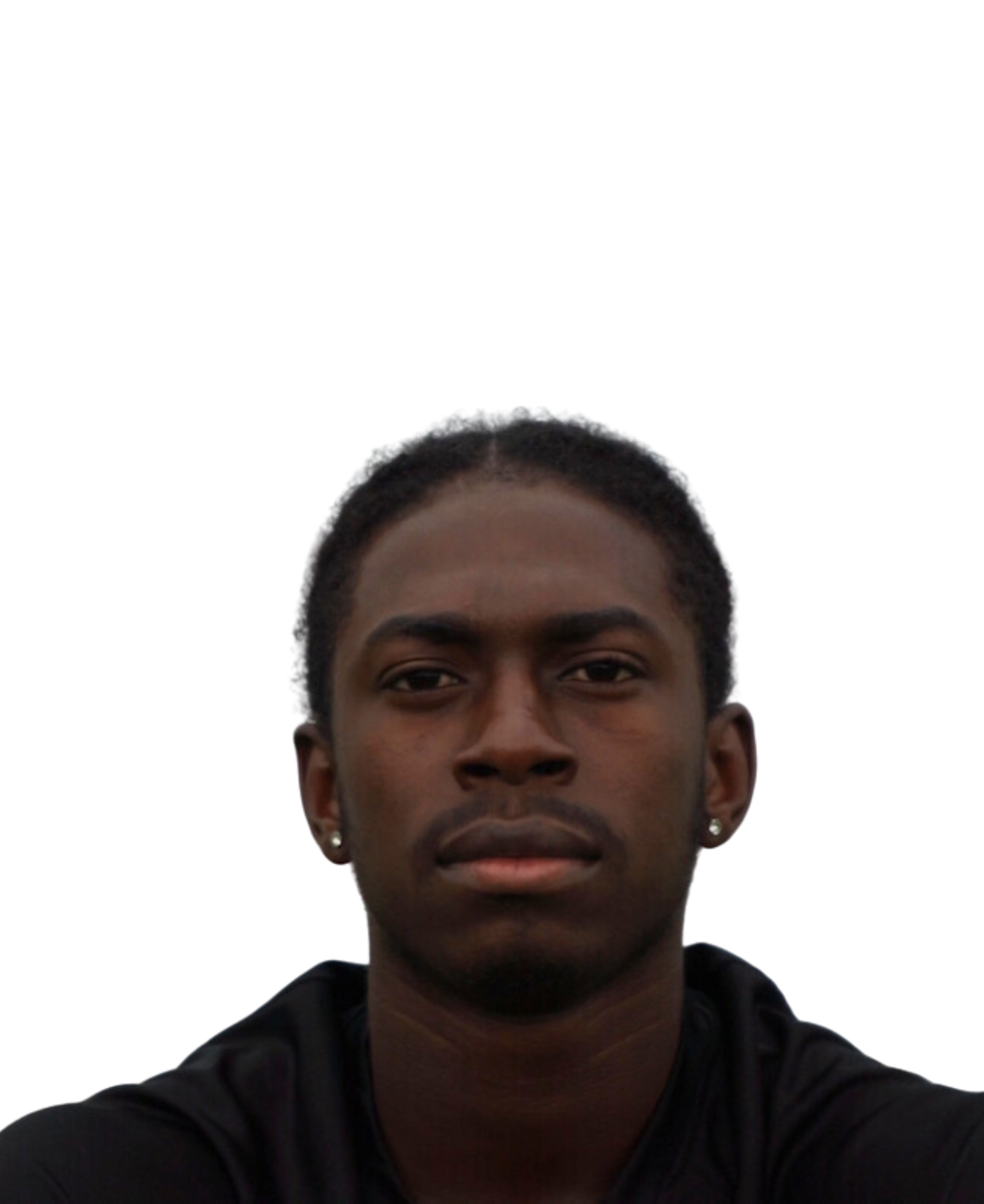 A young Black man with short dreadlocks, wearing a black hoodie, and staring straight ahead.