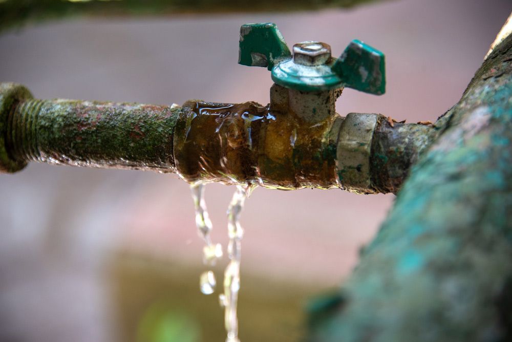 A Close Up of a Faucet With Water Leaking Out of It — All Plumb & Gas in North Boambee Valley, NSW