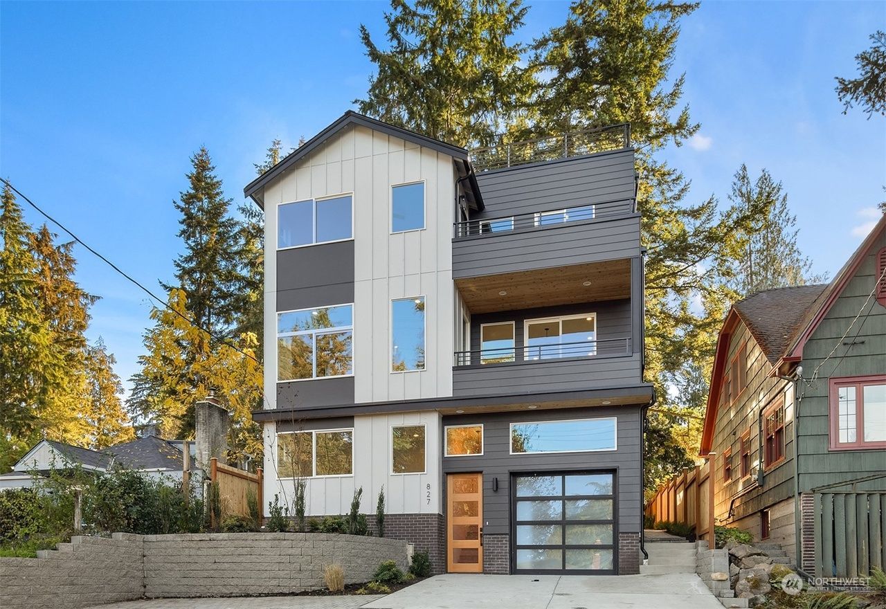 A modern house with a garage and a lot of windows