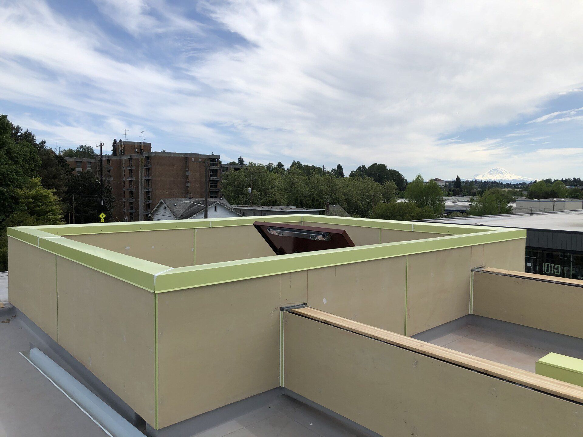 A view of a city from the roof of a building.
