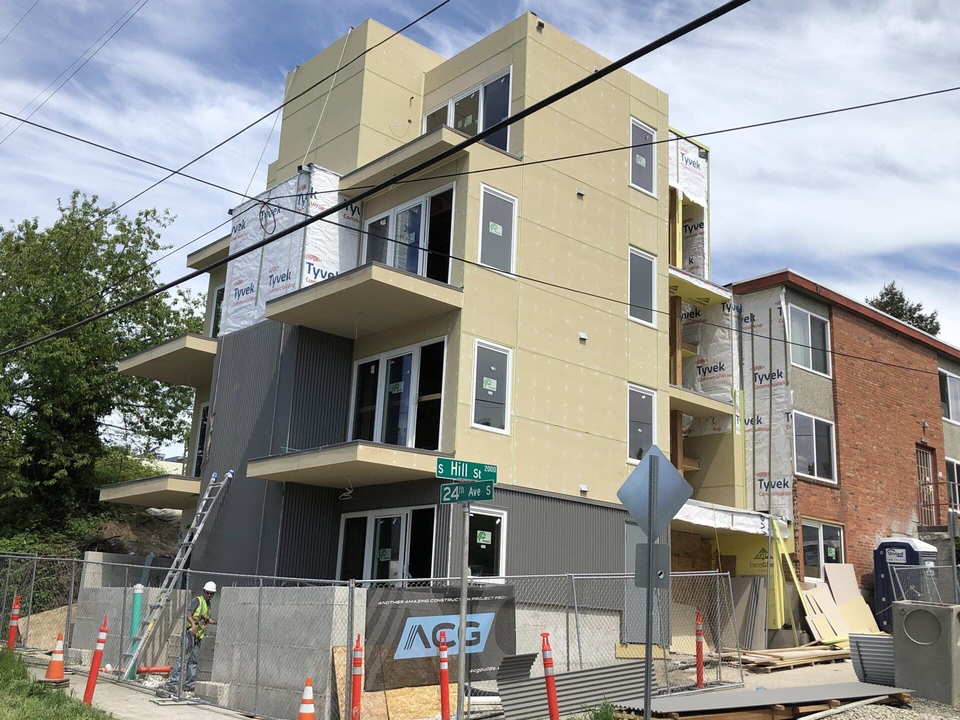 A building under construction with a sign that says ags on it